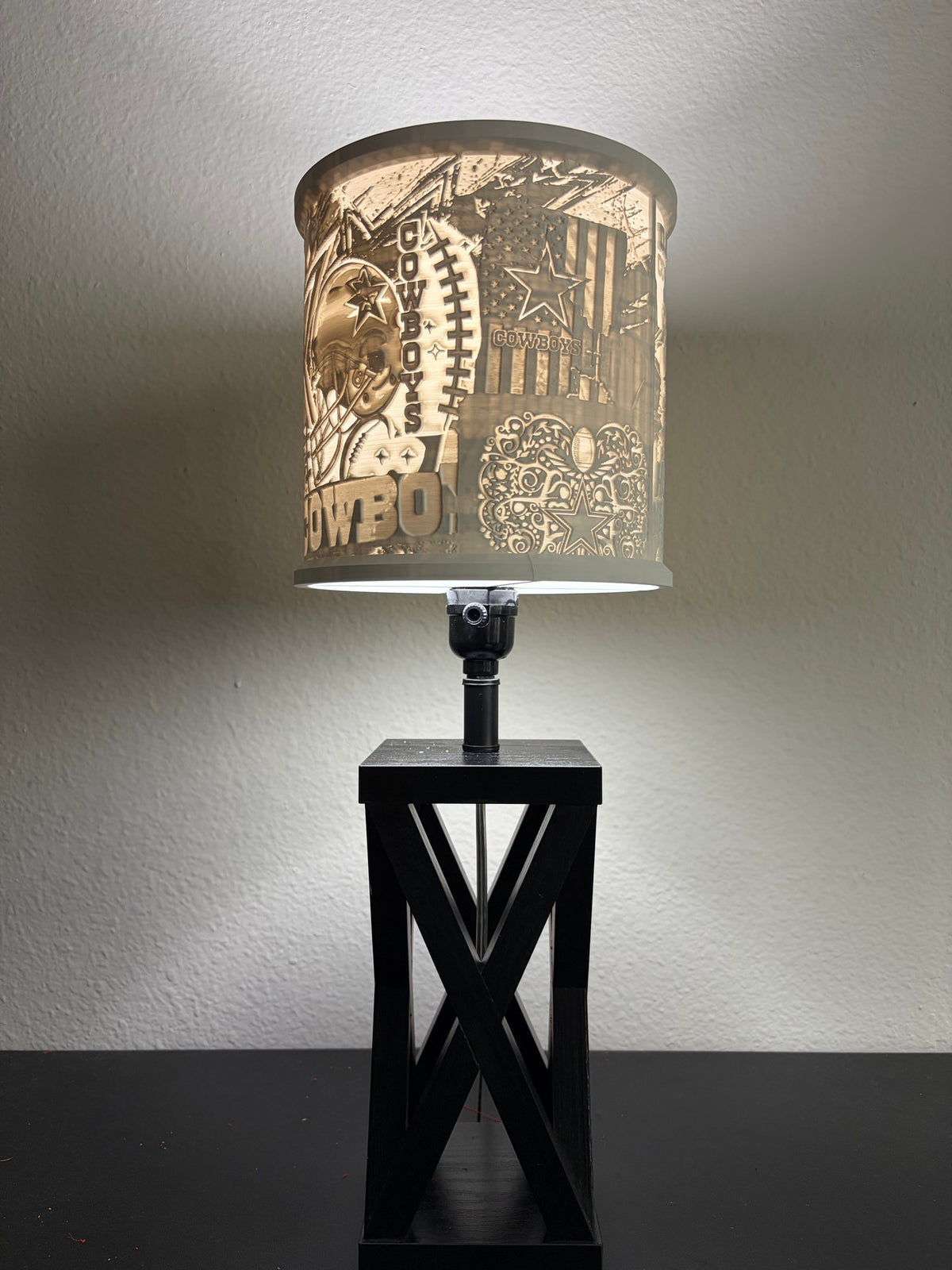 Side view of Dallas Cowboy lampshade showing football, flag and star artwork