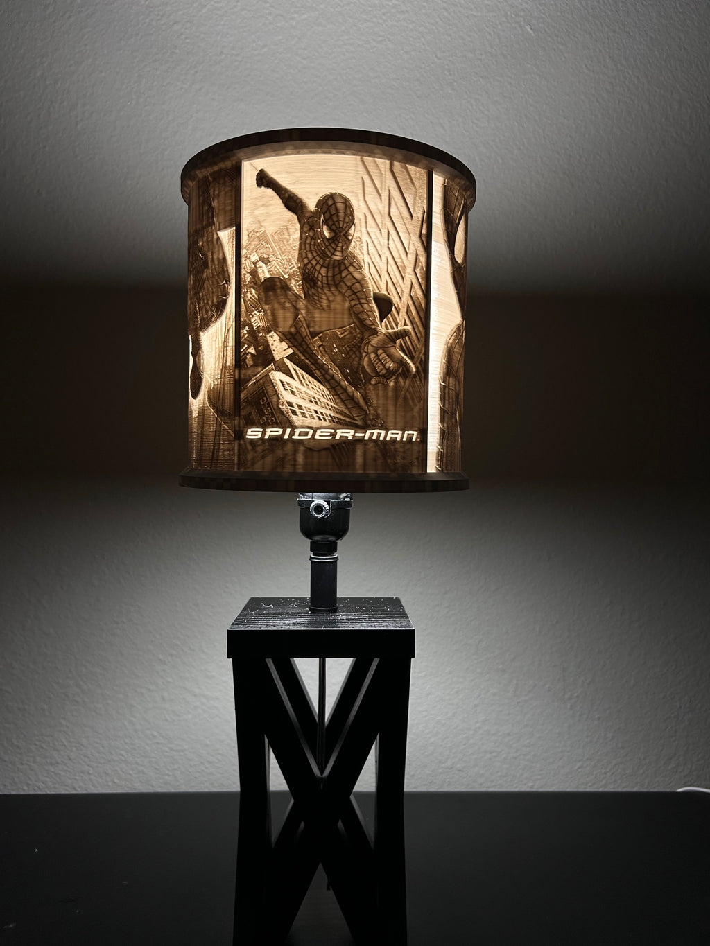 Spider-Man inspired custom 3D-printed lampshade by Dream Layer Studios, city-swinging panel with SPIDER-MAN title, lit up (image 1 of 4)